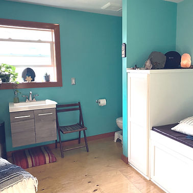 Clean, calm, and cozy holistic wellness studio interior for energy healing and colonics in Portland, Oregon