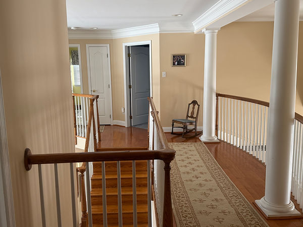 Interior balcony and hallway with newly painted walls and trim
