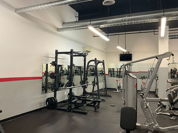 Commercial gym area with professional interior painting and fitness equipment