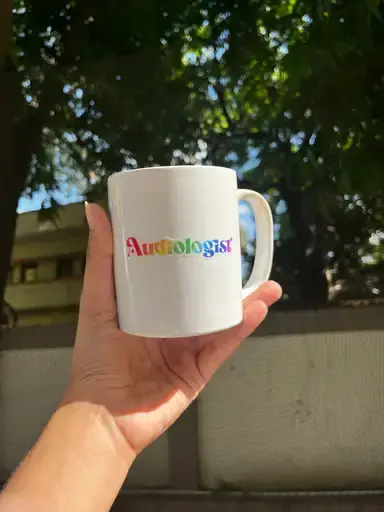 Rainbow-colored "Anthology" mug