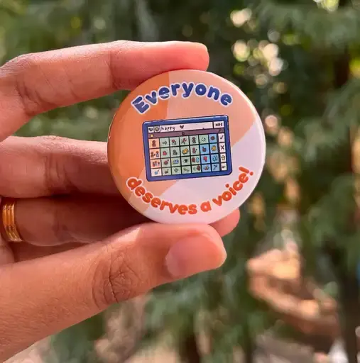 Hand holding button: Everyone deserves a voice