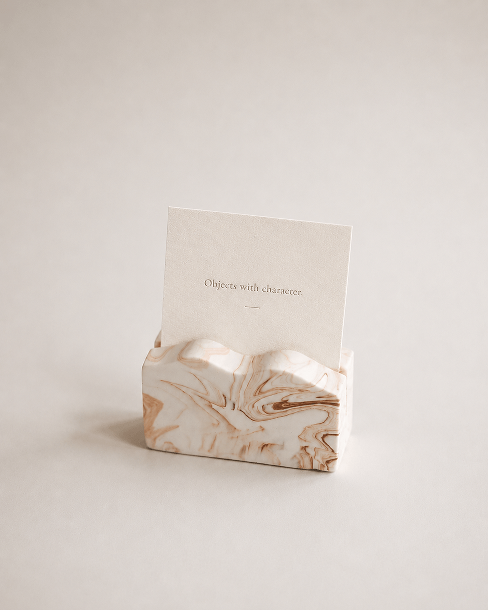 Ridge No. 1 sculptural card holder in Sand Vein, hand-cast mineral composite business card holder by Guseli Design.