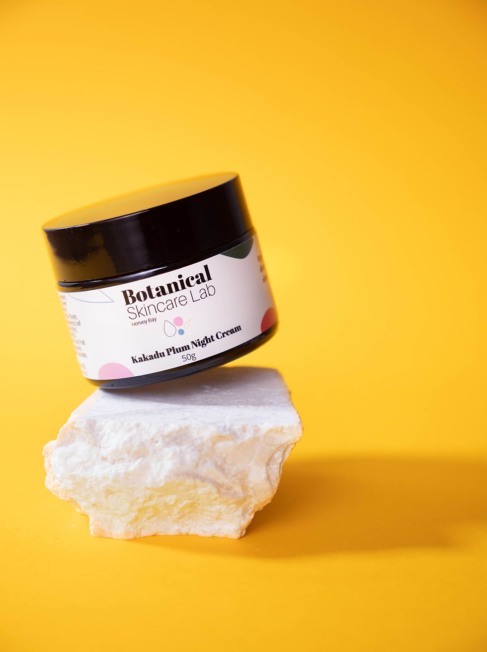 Thumbnail: Detailed view of the Kakadu Plum Night Cream jar, emphasizing the vibrant label and luxurious appeal