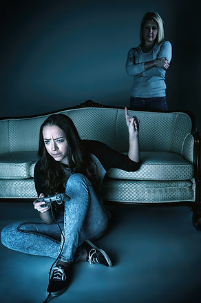 Teenage girl playing a video game with a