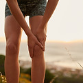 fitness-hands-woman-with-knee-pain-nature-training-with-muscle-inflation-burnout-legs-inju