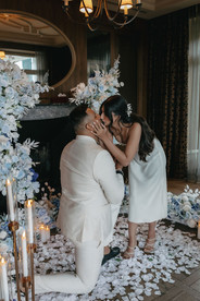 Boyfriend and girlfriend kiss after marriage proposal and saying yes at the cigar room in Villa Honegg, Switzerland