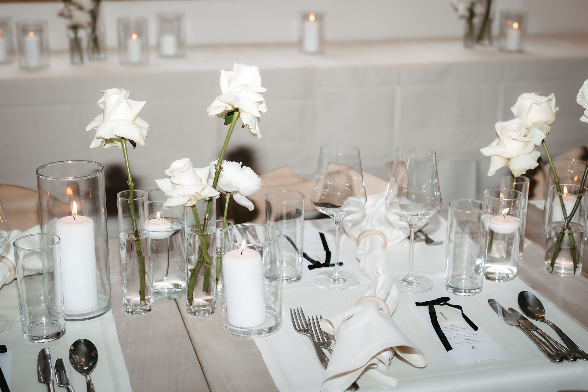 close up of the table decorations with a flash light at hotel Sonmmatten in Zermatt on a wedding day with a white palette 