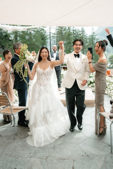 Groom and bride's ceremony exit cheered by their families. Cervo hotel in Zermatt. Destination wedding in Zermatt, Switzerland.