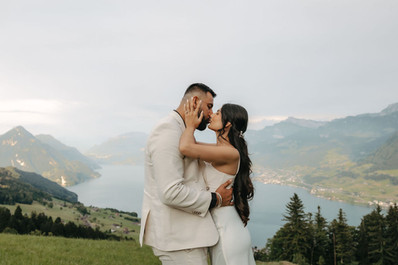 Couple kissing in front of the hotel Villa Honegg on their marriage proposal photoshoot, in Switzerland