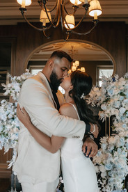 Couple kissing after marriage proposalat the cigar room in Villa Honegg, Switzerland