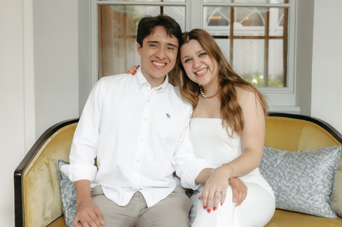 A luxury marriage proposal in Zurich, Switzerland at 5 stars hotel Baur au Lac with Tiffany and co diamond ring: couple posing seated together holding hands with diamond ring