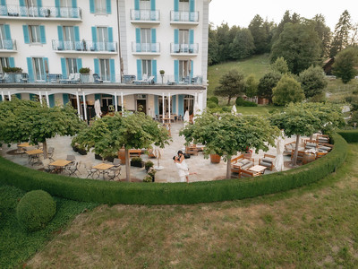 Drone picture of a couple in front of hotel villa honegg for their marriage proposal 