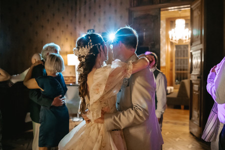 Schloss schadau castle in lake thun, Switzerland, during a wedding: bride and groom dancing together during party