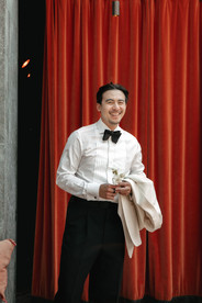 Groom posing at getting ready Cervo hotel in Zermatt. Destination wedding in Zermatt, Switzerland.