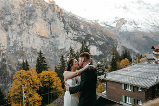 Bride and groom posing on their elopement in the mountains in the alps in Murren, Switzerland