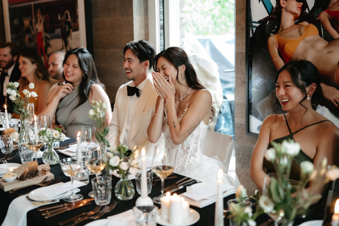 Bride and groom laughing during dinner and speeches. Cervo hotel in Zermatt. Destination wedding in Zermatt, Switzerland.