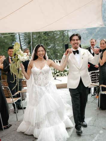 bride and groom posing from destination wedding at Cervo Zermatt. Wedding photographer in Switzerland. Ceremony exit. 