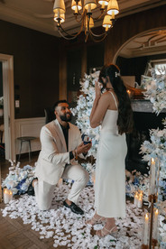 Fiance kneeled down in front of his girlfriend proposing to her marriage, at the cigar room in Villa Honegg, Switzerland