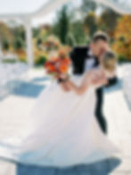 Katie and Alex share a kiss during their wedding ceremony. Photo courtesy of Addy Rae Photography.