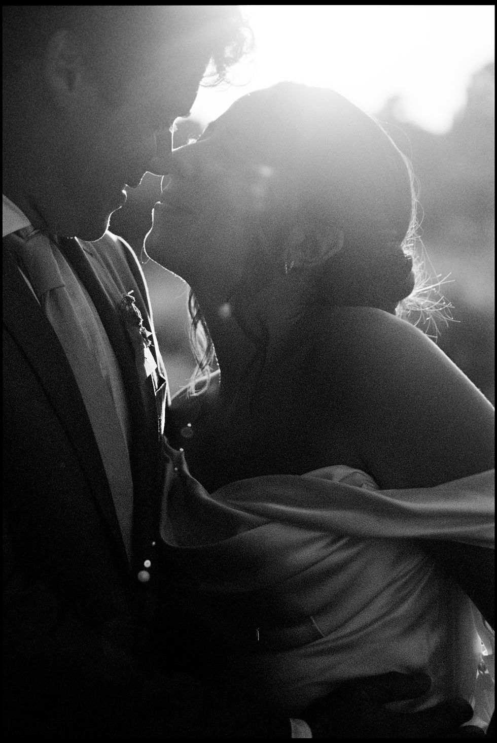 Bride and groom, Savannah and Zeke share an intimate moment after their wedding ceremony. Photo courtesy of Hannah Shea.