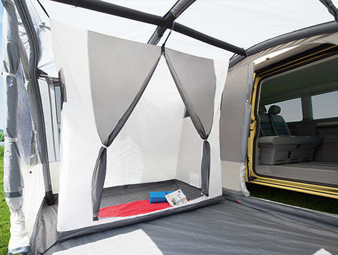 Van with attached tent, white and grey, open door, Zelte und Schlafsäcke, outdoor camping.