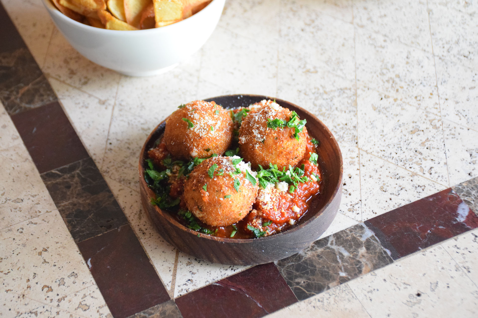A serve of three Sneaky's house made Arancini Balls