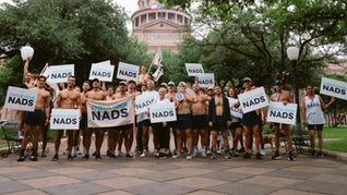 Men in their underwear marching for testicular cancer awareness