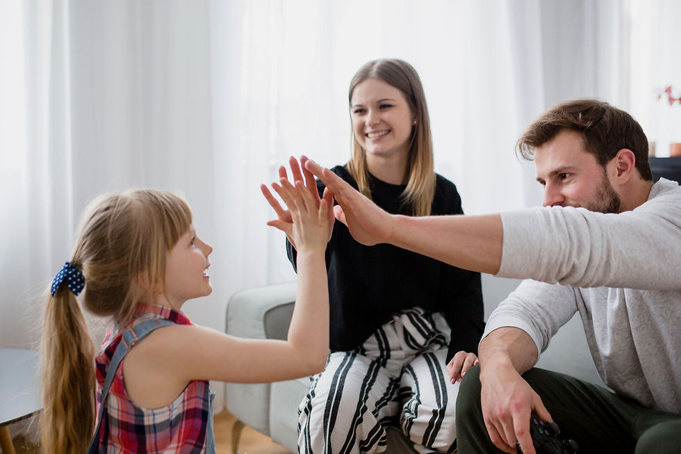 family-high-fiving-living-room.jpg