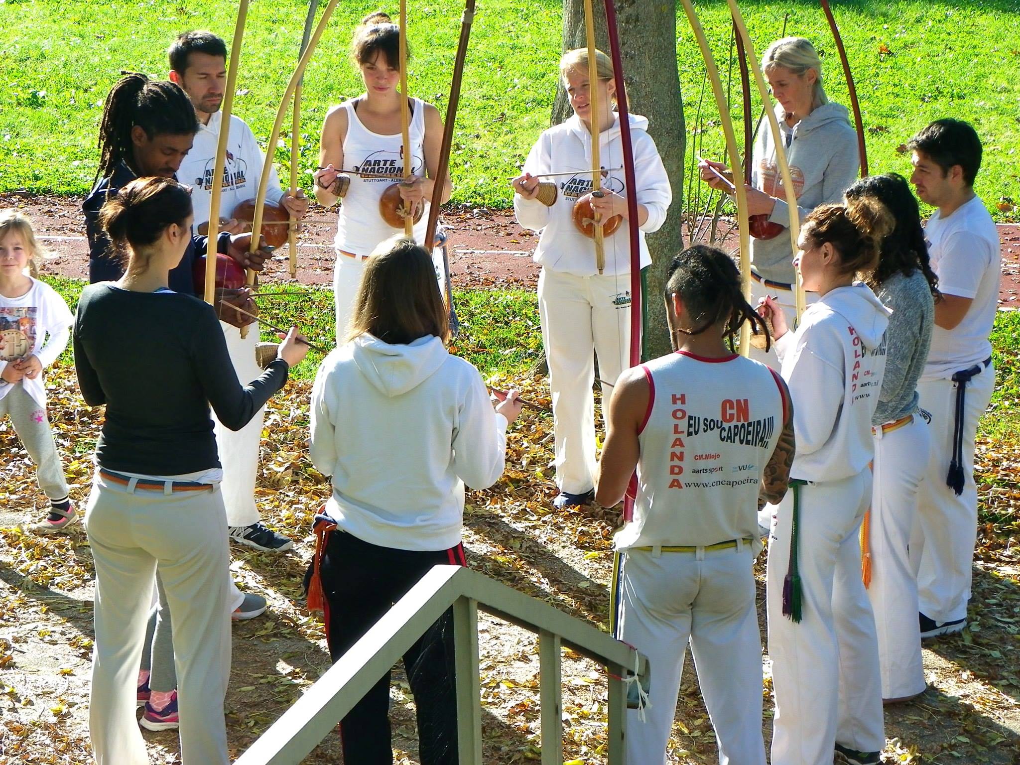Capoeira group practices outdoors