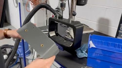 Workcell for drilling precise holes in sprayer