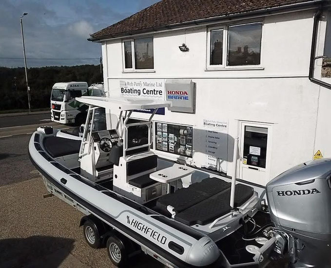 Highfield Sport in whit outside the Rob Perry Marine premises.