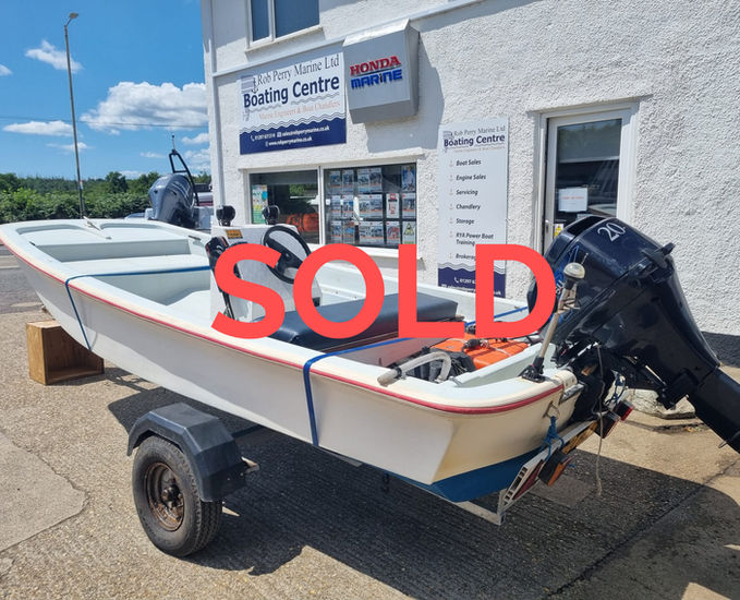 Dory fishing boat with Tohatsu outboard for sale