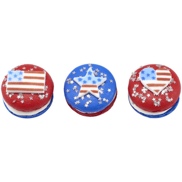 three cupcakes with heart flag, star flag, and flag shaped sugar decorations