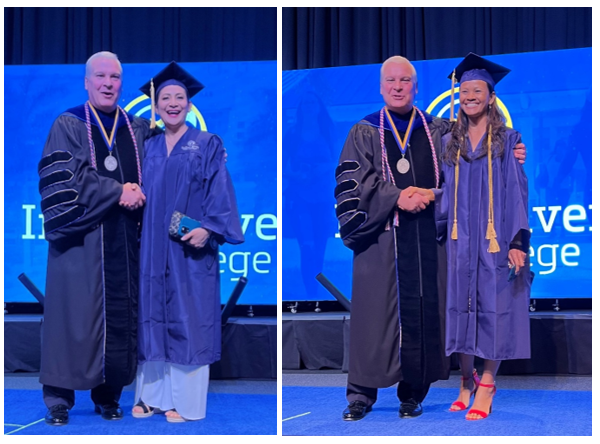 Two graduates in purple gowns shake hands with a man in academic regalia on stage. A blue backdrop reads "College." Smiles all around.
