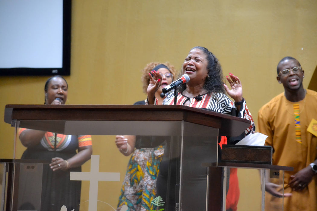 Woman joyfully leads gospel choir