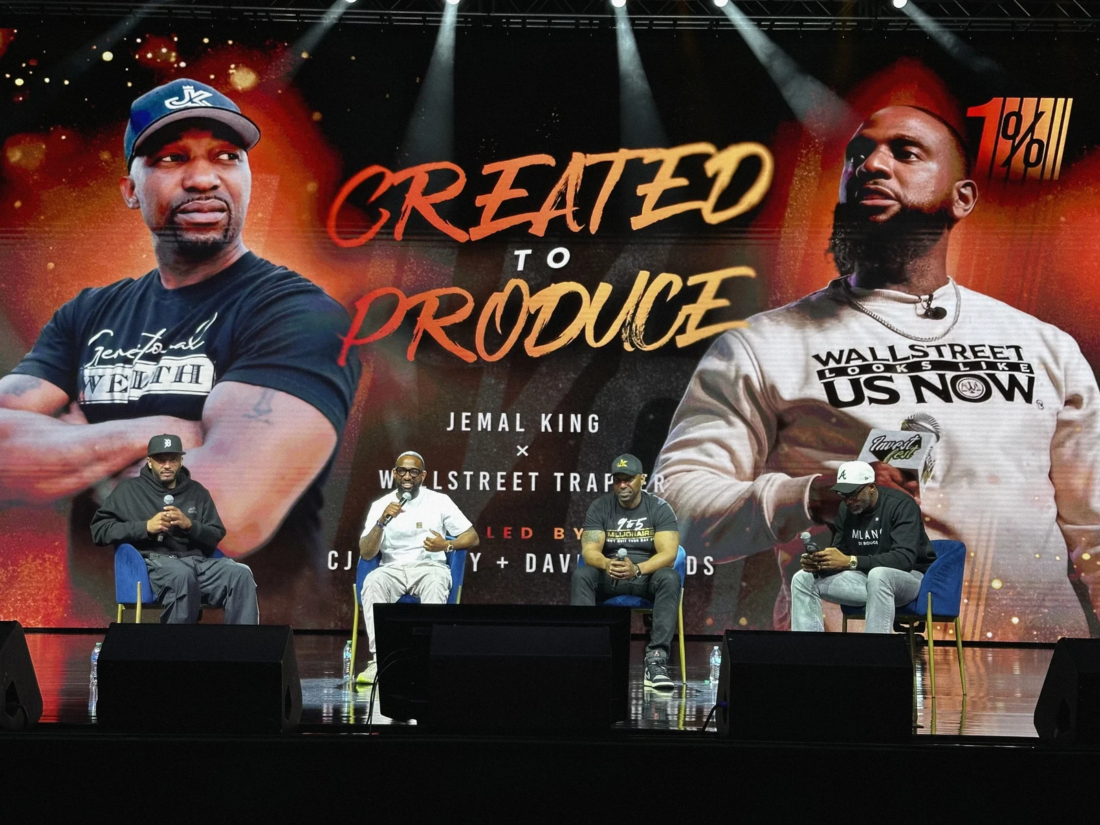 1% Conference panel with Created to Produce stage graphics.