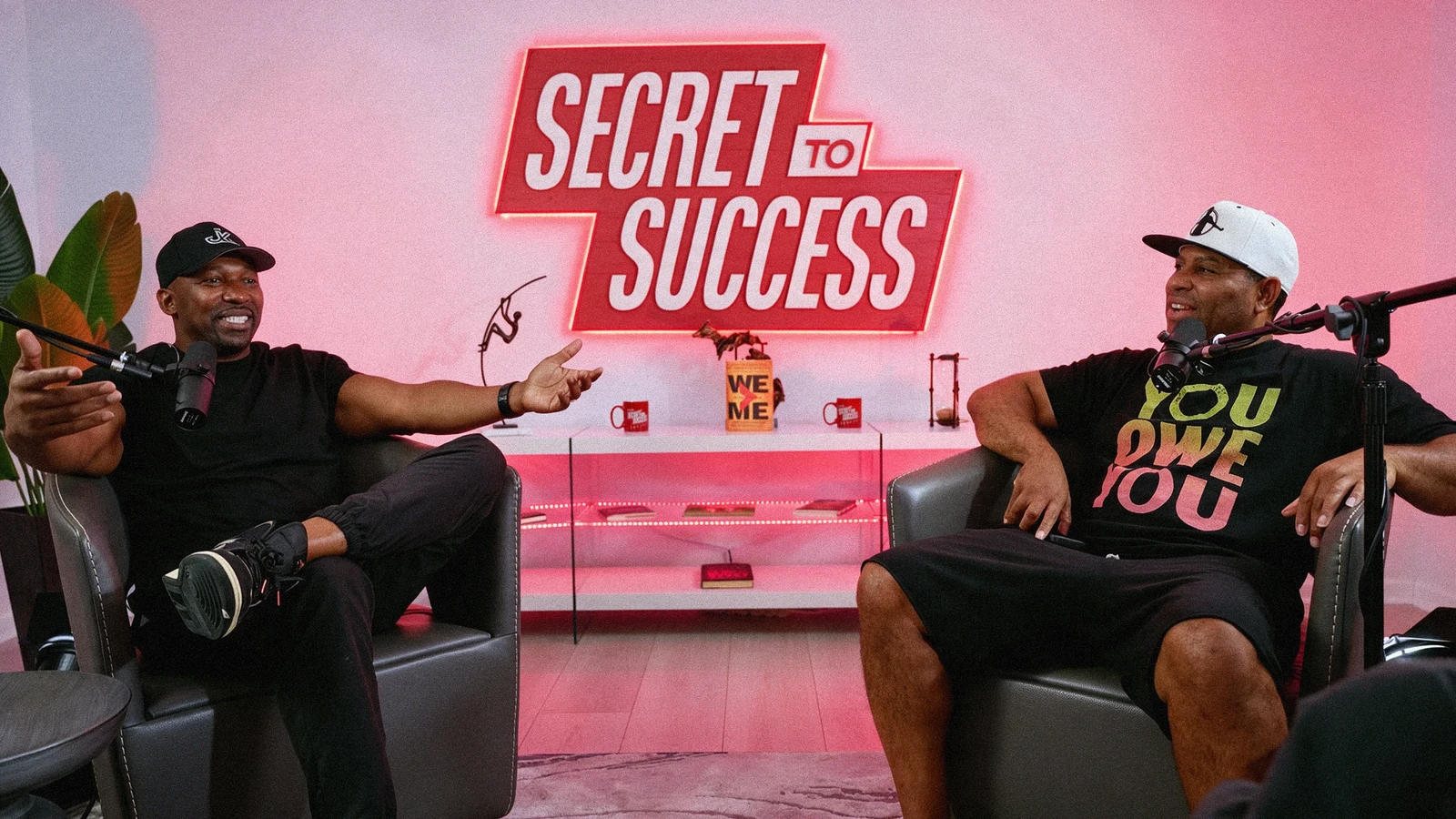Two speakers recording a conversation in the Secret to Success podcast studio.