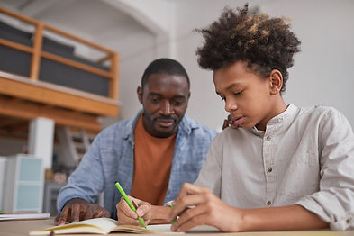 MAN with boy homework.jpeg