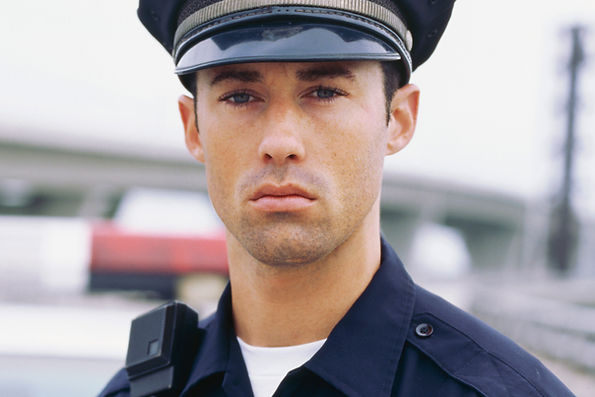Police officer looking sternly
