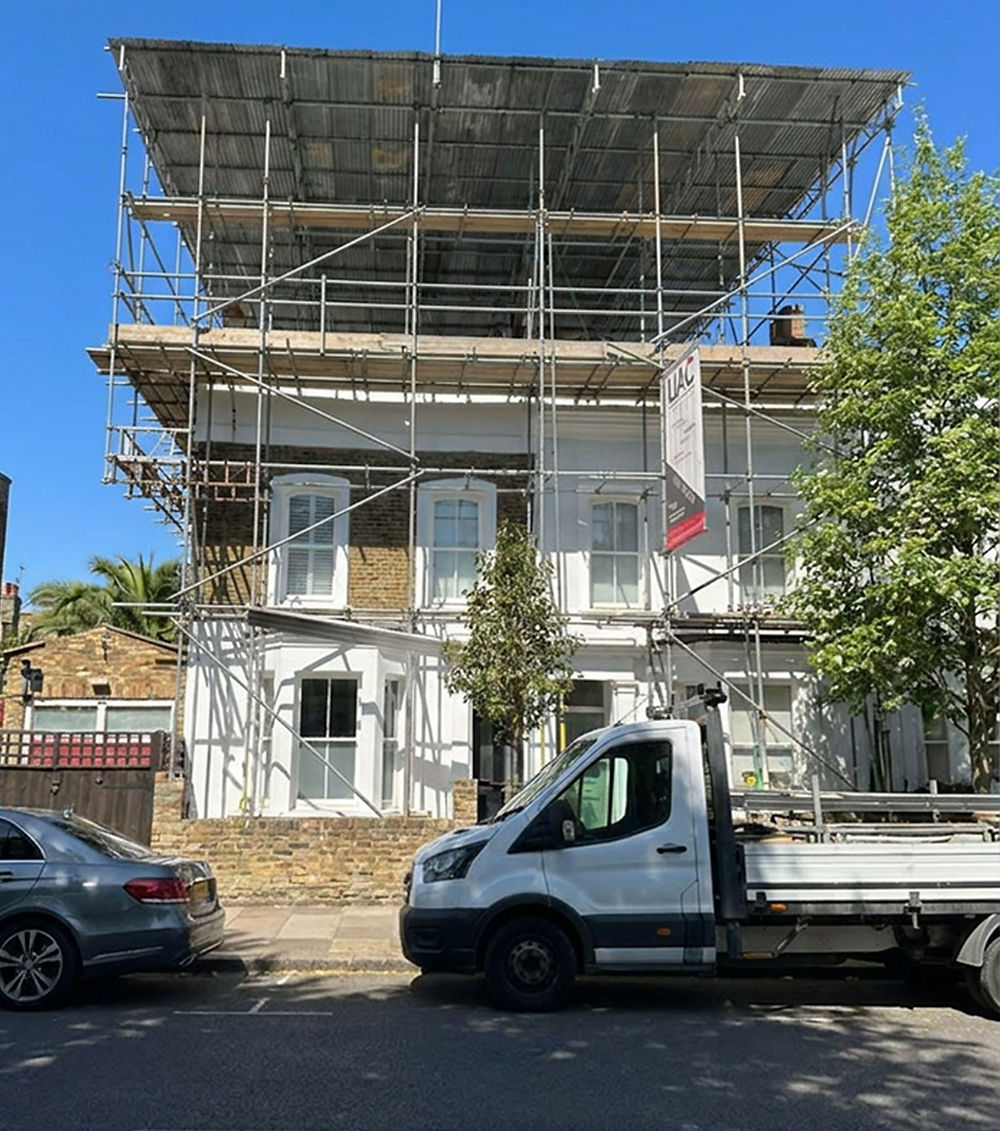 Mansard loft conversion under construction with scaffolding on a North London home in Archway N19.