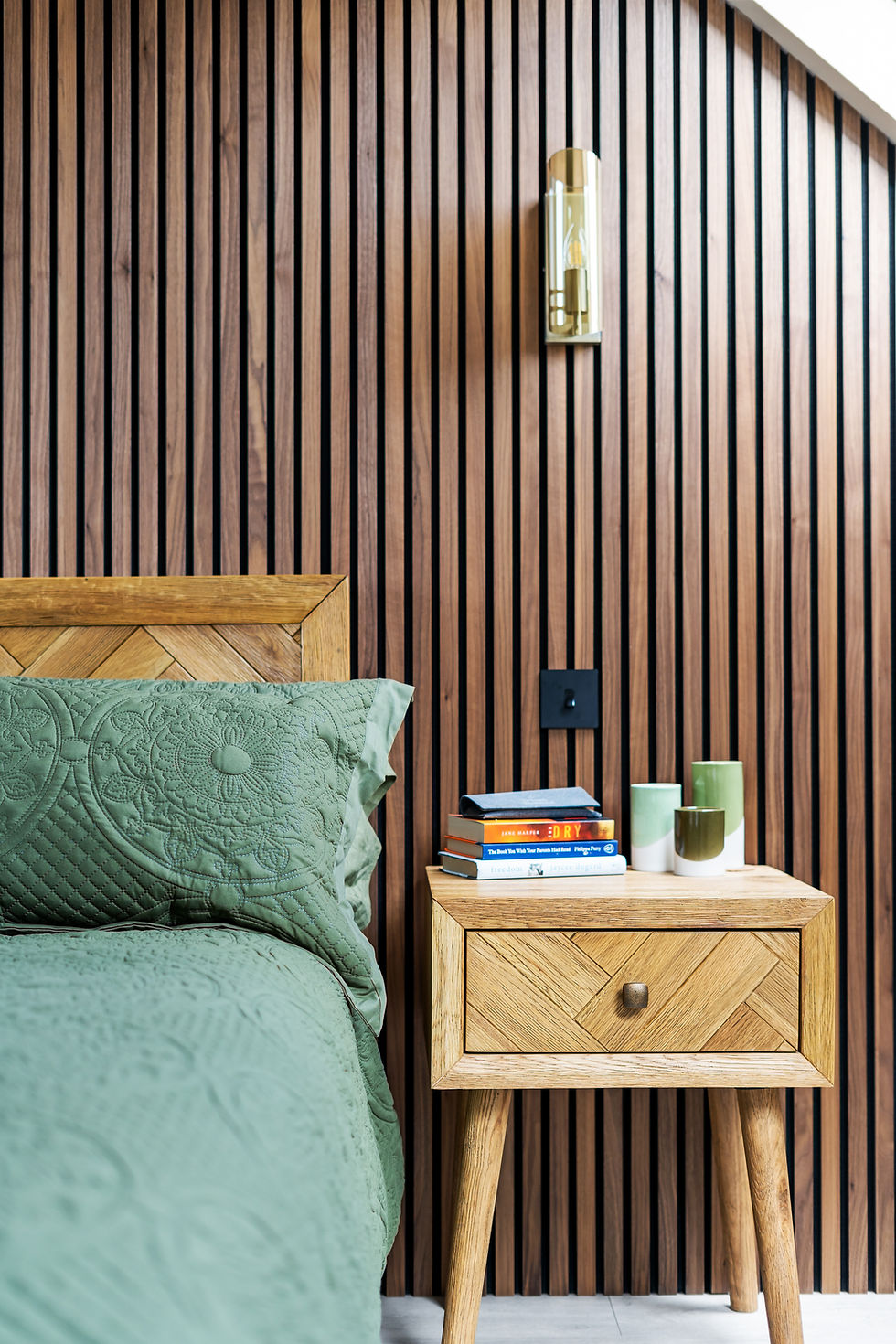 Modern bedroom loft conversion Muswell Hill with slatted wall.