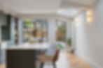 House extension interior with Crittall-style windows and wooden floor London by LLAC