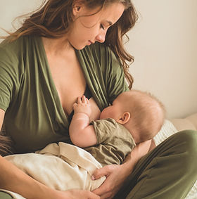 The concept of breastfeeding. Portrait of mom and breastfeeding baby. .jpg