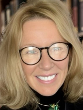 Virginia Pierce, therapist at Empower Psychotherapy, smiling in a light-colored top with blond hair and glasses, pictured against a soft, neutral background.