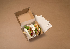 Two bao buns in a takeaway box