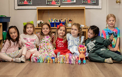 Pre-k girls doing indoor imaginitive play.