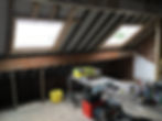 Roof windows being installed in loft bedroom