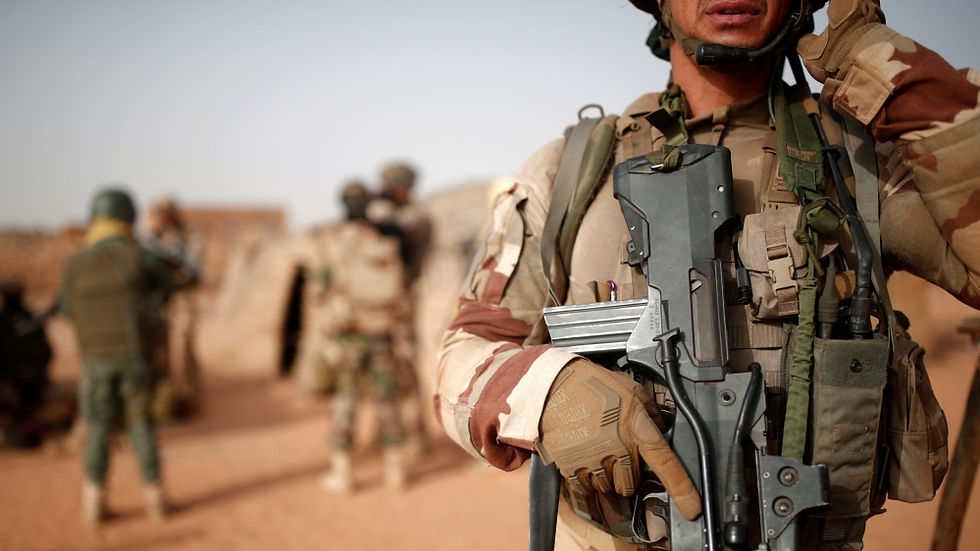 Malian troops and French soldiers during a 2017 joint patrol in Inaloglog [Benoit Tessier/Reuters]