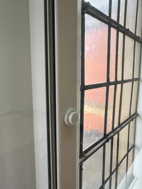 Easy open push button on our Horizontal sliding secondary glazing.