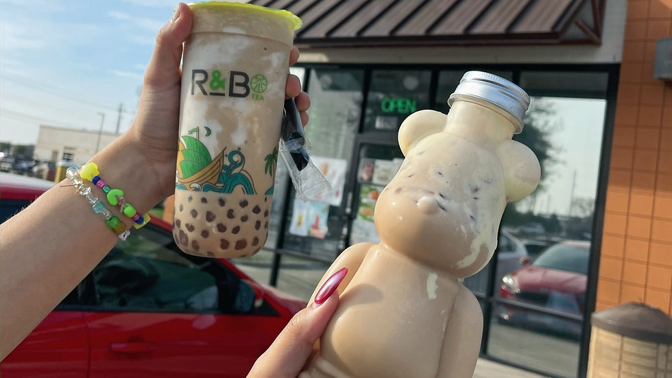 hands holding a plastic bottle of boba tea and a plastic bear-shaped bottle of boba tea